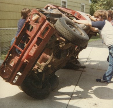 Putting the car on its side to work on the bottom